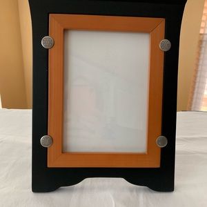 Beautiful Picture Frame holds 5” x 7” pictures. Black & light Brown edges